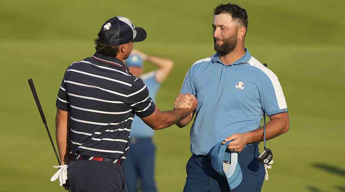 Europe's Jon Rahm shakes hands with United States' Brooks Koepka after the match was tied in their afternoon fourballs match at the 2023 Ryder Cup golf tournament at the Marco Simone Golf Club in Italy.